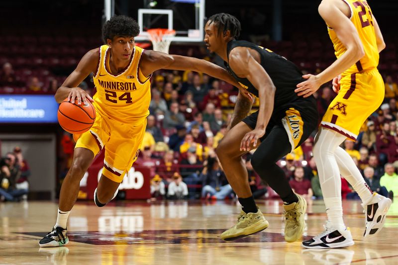 Nov 21, 2023; Minneapolis, Minnesota, USA; Minnesota Golden Gophers guard Cam Christie (24) works around Arkansas-Pine Bluff Golden Lions guard Kylen Milton (1) during the first half at Williams Arena. Mandatory Credit: Matt Krohn-USA TODAY Sports