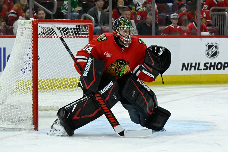 Jan 18, 2025; Chicago, Illinois, USA;  Chicago Blackhawks goaltender Petr Mrazek (34) defends against the Vegas Golden Knights during the first period at United Center. Mandatory Credit: Matt Marton-Imagn Images