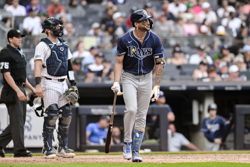 Jul 21, 2024; Bronx, New York, USA; Tampa Bay Rays outfielder Jose Siri (22) watches the flight of his two-run home run against the New York Yankees during the seventh inning at Yankee Stadium. Mandatory Credit: John Jones-USA TODAY Sports