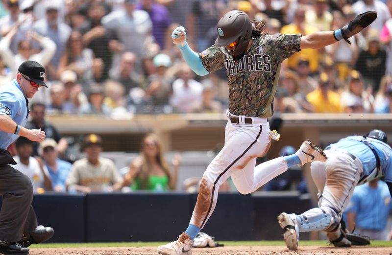 Jun 18, 2023; San Diego, California, USA;  San Diego Padres right fielder Fernando Tatis Jr. (23) scores on a fielders choice by left fielder Juan Soto (not pictured) against the Tampa Bay Rays during the third inning at Petco Park. Mandatory Credit: Ray Acevedo-USA TODAY Sports