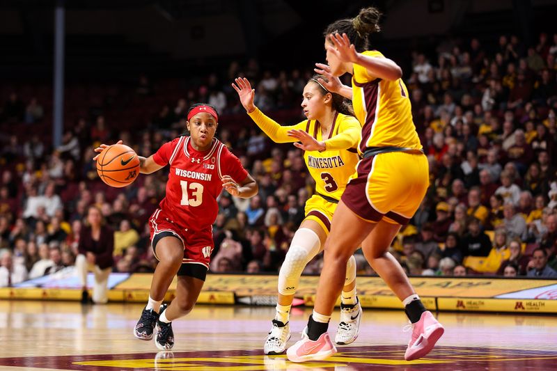 Feb 20, 2024; Minneapolis, Minnesota, USA; Wisconsin Badgers guard Ronnie Porter (13) works around Minnesota Golden Gophers guard Amaya Battle (3) and forward Ayianna Johnson (1) during the second half at Williams Arena. Mandatory Credit: Matt Krohn-USA TODAY Sports