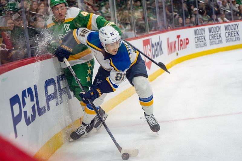 Mar 15, 2025; Saint Paul, Minnesota, USA; St. Louis Blues center Dylan Holloway (81) checks Minnesota Wild right wing Mats Zuccarello (36) in the corner and retrieves the puck in the first period at Xcel Energy Center. Mandatory Credit: Matt Blewett-Imagn Images