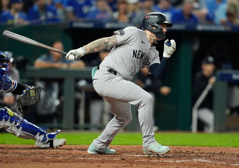 Oct 10, 2024; Kansas City, Missouri, USA; New York Yankees outfielder Alex Verdugo (24) hits into a fielders choice during the fifth inning against the Kansas City Royals during game four of the ALDS for the 2024 MLB Playoffs at Kauffman Stadium. Mandatory Credit: Jay Biggerstaff-Imagn Images
