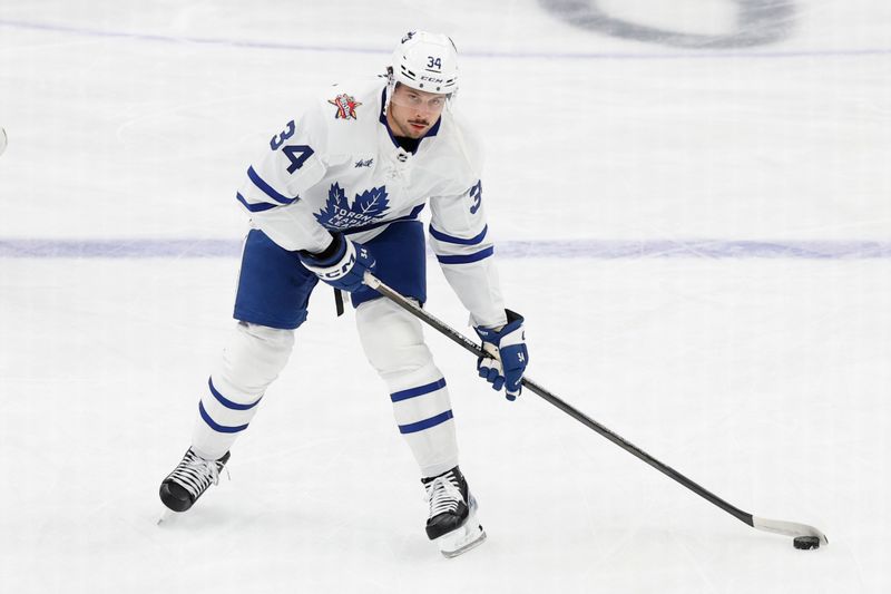 Oct 24, 2023; Washington, District of Columbia, USA; Toronto Maple Leafs center Auston Matthews (34) skates with the puck during warmup prior to the game against the Washington Capitals at Capital One Arena. Mandatory Credit: Geoff Burke-USA TODAY Sports