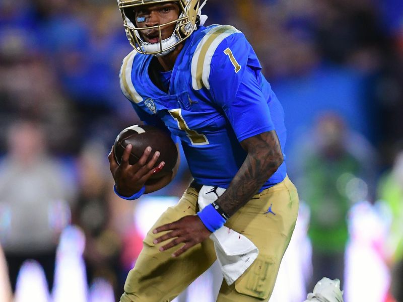 Oct 2, 2021; Pasadena, California, USA; UCLA Bruins quarterback Dorian Thompson-Robinson (1) runs the ball against the Arizona State Sun Devils during the first half at Rose Bowl. Mandatory Credit: Gary A. Vasquez-USA TODAY Sports