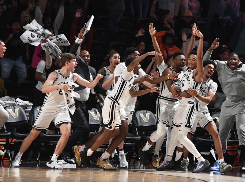 Feb 8, 2023; Nashville, Tennessee, USA; Vanderbilt Commodores guard Tyrin Lawrence (0) celebrates after making the game-winning three-pointer at the buzzer to bear the Tennessee Volunteers at Memorial Gymnasium. Mandatory Credit: Christopher Hanewinckel-USA TODAY Sports