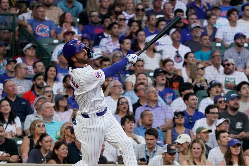 Jun 18, 2024; Chicago, Illinois, USA; Chicago Cubs shortstop Dansby Swanson (7) hits a two-run home run against the San Francisco Giants during the second inning at Wrigley Field. Mandatory Credit: David Banks-USA TODAY Sports