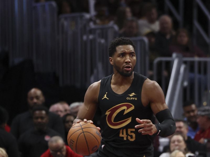 CLEVELAND, OH - DECEMBER 3: Donovan Mitchell #45 of the Cleveland Cavaliers dribbles the ball during the game against the Washington Wizards in the NBA Cup on December 3, 2024 at Rocket Mortgage FieldHouse in Cleveland, Ohio. NOTE TO USER: User expressly acknowledges and agrees that, by downloading and/or using this Photograph, user is consenting to the terms and conditions of the Getty Images License Agreement. Mandatory Copyright Notice: Copyright 2024 NBAE (Photo by  Lauren Leigh Bacho/NBAE via Getty Images)