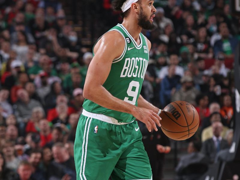 PORTLAND, OR - MARCH 17: Derrick White #9 of the Boston Celtics dribbles the ball during the game against the Portland Trail Blazers on March 17, 2023 at the Moda Center Arena in Portland, Oregon. NOTE TO USER: User expressly acknowledges and agrees that, by downloading and or using this photograph, user is consenting to the terms and conditions of the Getty Images License Agreement. Mandatory Copyright Notice: Copyright 2023 NBAE (Photo by Cameron Browne/NBAE via Getty Images)