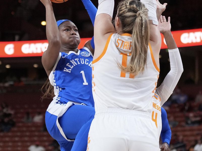 Mar 3, 2023; Greenville, SC, USA; Kentucky Wildcats guard Robyn Benton (1) shoots the ball over Tennessee Lady Vols forward Karoline Striplin (11) in the first quarter at Bon Secours Wellness Arena. Mandatory Credit: David Yeazell-USA TODAY Sports