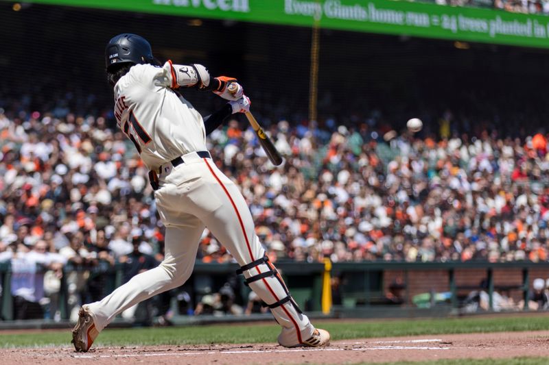 Apr 28, 2024; San Francisco, California, USA;  San Francisco Giants center fielder Jung Hoo Lee (51) hits a single against the Pittsburgh Pirates during the third inning at Oracle Park. Mandatory Credit: John Hefti-USA TODAY Sports