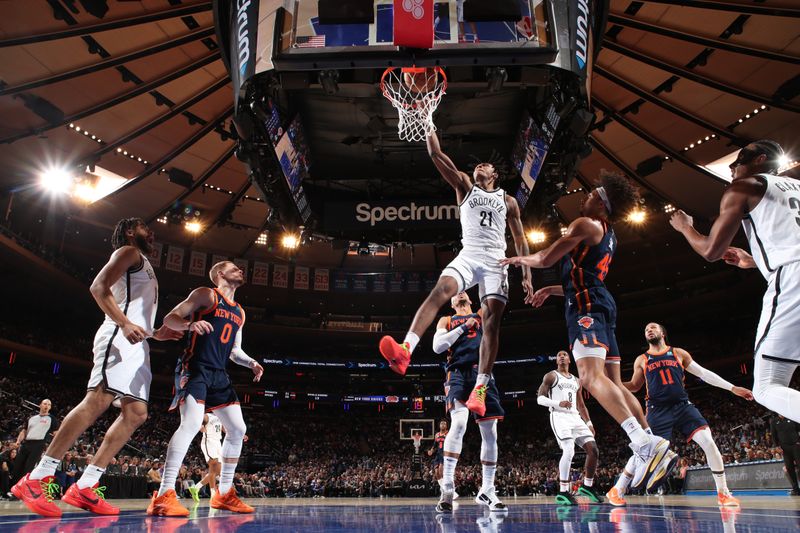 NEW YORK, NY - APRIL 12: Noah Clowney #21 of the Brooklyn Nets  dunks the ball during the game against the New York Knicks on April 12, 2024 at Madison Square Garden in New York City, New York.  NOTE TO USER: User expressly acknowledges and agrees that, by downloading and or using this photograph, User is consenting to the terms and conditions of the Getty Images License Agreement. Mandatory Copyright Notice: Copyright 2024 NBAE  (Photo by Nathaniel S. Butler/NBAE via Getty Images)