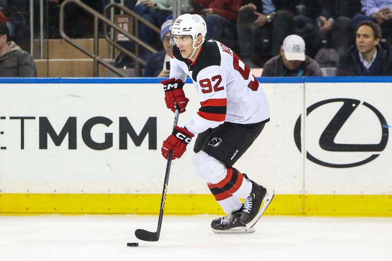 Apr 3, 2024; New York, New York, USA; New Jersey Devils left wing Tomas Nosek (92) controls the puck in the third period against the New York Rangers at Madison Square Garden. Mandatory Credit: Wendell Cruz-USA TODAY Sports