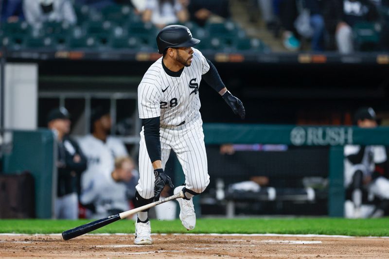May 9, 2024; Chicago, Illinois, USA; Chicago White Sox outfielder Tommy Pham (28) hits an RBI-single against the Cleveland Guardians during the second inning at Guaranteed Rate Field. Mandatory Credit: Kamil Krzaczynski-USA TODAY Sports