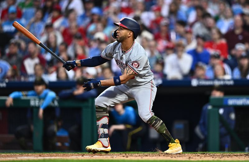 May 17, 2024; Philadelphia, Pennsylvania, USA; Washington Nationals outfielder Eddie Rosario (8) hits an RBI double against the Philadelphia Phillies in the fifth inning at Citizens Bank Park. Mandatory Credit: Kyle Ross-USA TODAY Sports