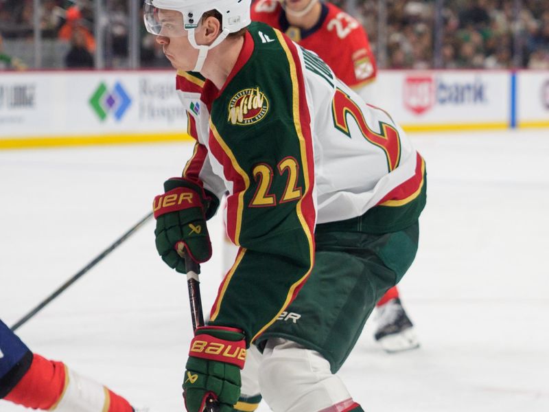 Jan 24, 2026; Saint Paul, Minnesota, USA; Minnesota Wild right wing Danila Yurov (22) shoots by the defense of Florida Panthers defenseman Uvis Balinskis (26) in the second period at Grand Casino Arena. Mandatory Credit: Matt Blewett-Imagn Images