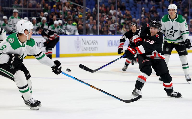 Feb 6, 2024; Buffalo, New York, USA;  Dallas Stars defenseman Nils Lundkvist (5) tries to block a shot by Buffalo Sabres center Peyton Krebs (19) during the second period at KeyBank Center. Mandatory Credit: Timothy T. Ludwig-USA TODAY Sports