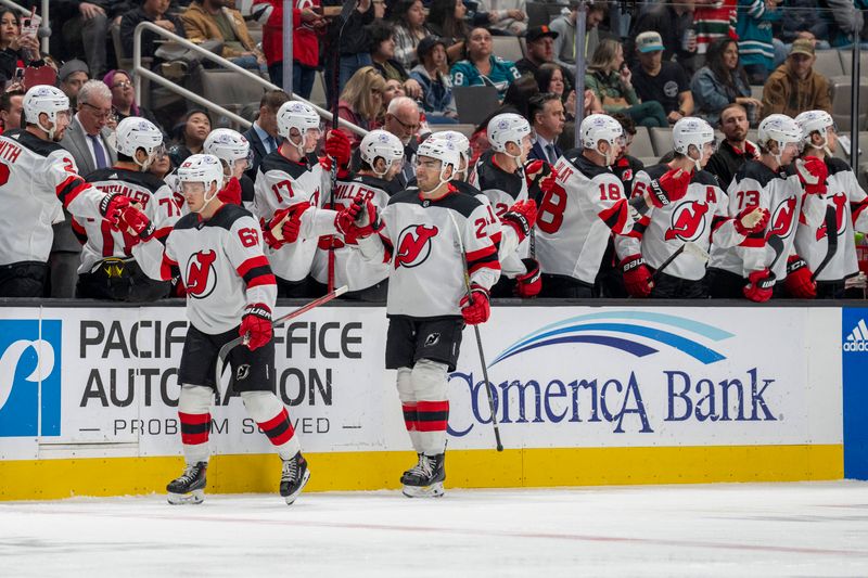 Feb 27, 2024; San Jose, California, USA;  New Jersey Devils left wing Jesper Bratt (63) celebrates with teammates after the goal against the San Jose Sharks during the second period at SAP Center at San Jose. Mandatory Credit: Neville E. Guard-USA TODAY Sports