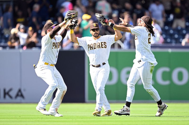 Sep 20, 2023; San Diego, California, USA; San Diego Padres center fielder Trent Grisham (center) celebrates with left fielder Juan Soto (left) and right fielder Fernando Tatis Jr. (23) after defeating the Colorado Rockies at Petco Park. Mandatory Credit: Orlando Ramirez-USA TODAY Sports