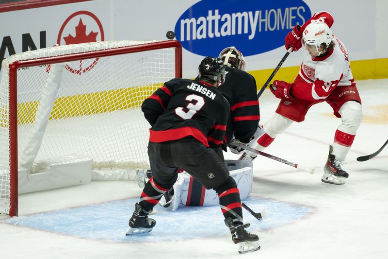 Dec 5, 2024; Ottawa, Ontario, CAN;  Ottawa Senators goalie Linus Ullmark (35) makes a save on a shot from Detroit Red Wings center Marco Kasper (92) in the third period at the Canadian Tire Centre. Mandatory Credit: Marc DesRosiers-Imagn Images