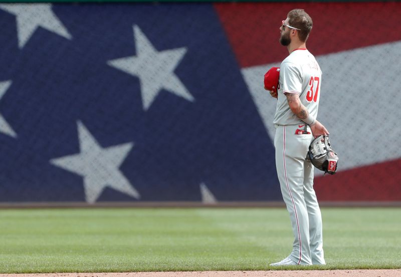 Jul 21, 2024; Pittsburgh, Pennsylvania, USA;  Philadelphia Phillies left fielder Weston Wilson (37) stands for the playing of God Bless America against the Pittsburgh Pirates during the seventh inning stretch at PNC Park. The Phillies won 6-0. Mandatory Credit: Charles LeClaire-USA TODAY Sports