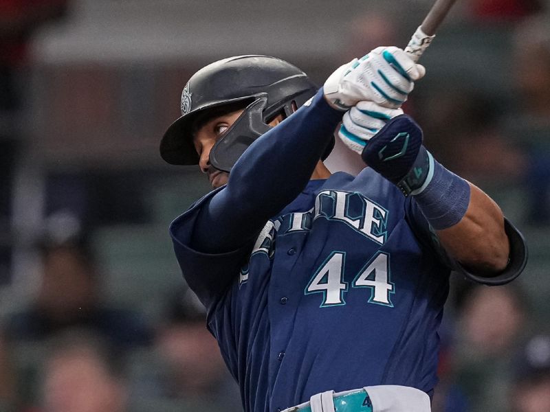 May 19, 2023; Cumberland, Georgia, USA; Seattle Mariners center fielder Julio Rodriguez (44) hits a double against the Atlanta Braves during the seventh inning at Truist Park. Mandatory Credit: Dale Zanine-USA TODAY Sports