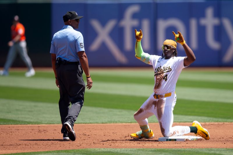 Jul 24, 2024; Oakland, California, USA; Oakland Athletics right fielder Lawrence Butler (4) celebrates after hitting a leadoff double against the Houston Astros during the first inning at Oakland-Alameda County Coliseum. Looking in is umpire CB Bucknor. Mandatory Credit: D. Ross Cameron-USA TODAY Sports