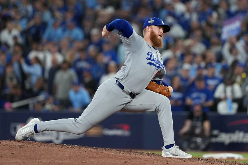 Oct 24, 2025; Toronto, Ontario, CAN; Los Angeles Dodgers pitcher Will Klein (61) pitches against the Toronto Blue Jays in the eighth inning during game one of the 2025 MLB World Series at Rogers Centre. Mandatory Credit: Nick Turchiaro-Imagn Images