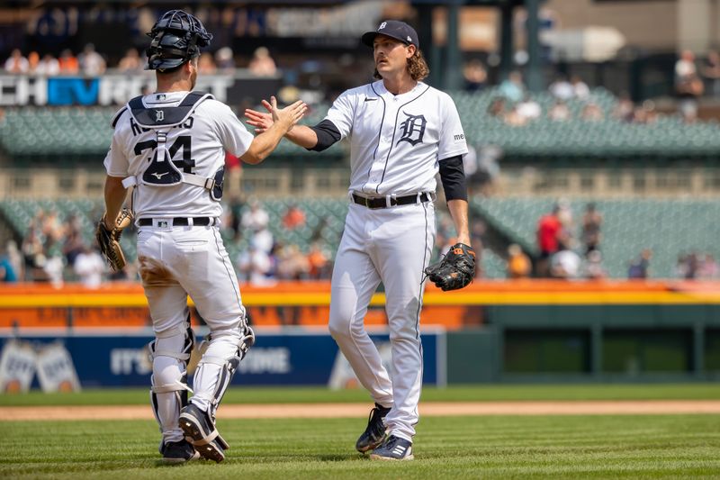 Jul 24, 2023; Detroit, Michigan, USA; Detroit Tigers catcher Jake Rogers (34) slaps hands with winning relief pitcher Jason Foley (68) at the end of the MLB game against the San Francisco Giants at Comerica Park. Mandatory Credit: David Reginek-USA TODAY Sports