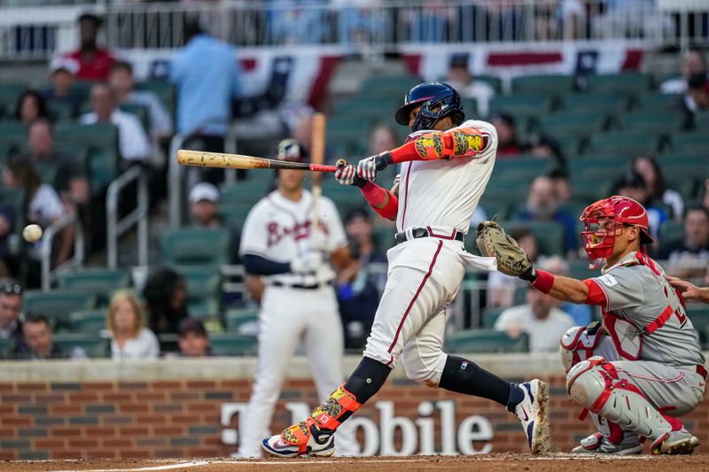 Apr 12, 2023; Cumberland, Georgia, USA; Atlanta Braves right fielder Ronald Acuna Jr. (13) singles to drive in two runs against the Cincinnati Reds during the second inning at Truist Park. Mandatory Credit: Dale Zanine-USA TODAY Sports