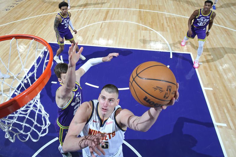 SALT LAKE CITY, UT - JANUARY 10: Nikola Jokic #15 of the Denver Nuggets drives to the basket during the game against the Utah Jazz on January 10, 2024 at Delta Center in Salt Lake City, Utah. NOTE TO USER: User expressly acknowledges and agrees that, by downloading and or using this Photograph, User is consenting to the terms and conditions of the Getty Images License Agreement. Mandatory Copyright Notice: Copyright 2024 NBAE (Photo by Melissa Majchrzak/NBAE via Getty Images)