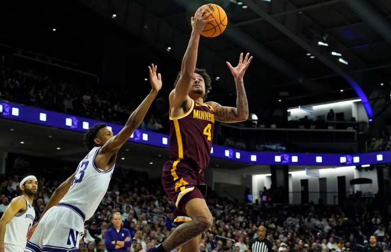 Mar 9, 2024; Evanston, Illinois, USA; Minnesota Golden Gophers guard Braeden Carrington (4) goes th the basket against Northwestern Wildcats guard Blake Smith (43) during the first half at Welsh-Ryan Arena. Mandatory Credit: David Banks-USA TODAY Sports