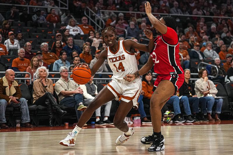 Jan 27, 2024; Austin, TX, USA; Texas Longhorns forward Amina Muhammad (14) drives against Cincinnati Bearcats center Destiny Thomas (32) during a game at the Moody Center. Mandatory Credit: Aaron E. Martinez/American-Statesman via USA TODAY NETWORK