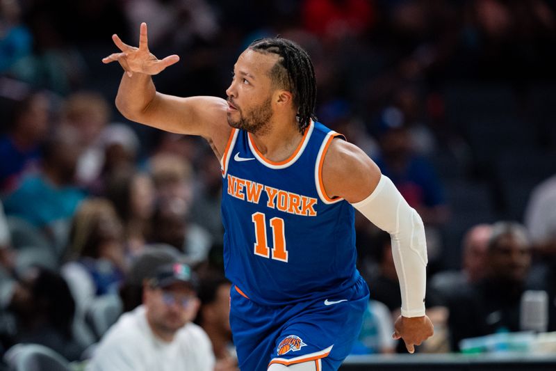 CHARLOTTE, NORTH CAROLINA - OCTOBER 06: Jalen Brunson #11 of the New York Knicks reacts in the first quarter during a preseason game against the Charlotte Hornets at Spectrum Center on October 06, 2024 in Charlotte, North Carolina. NOTE TO USER: User expressly acknowledges and agrees that, by downloading and or using this photograph, User is consenting to the terms and conditions of the Getty Images License Agreement. (Photo by Jacob Kupferman/Getty Images)