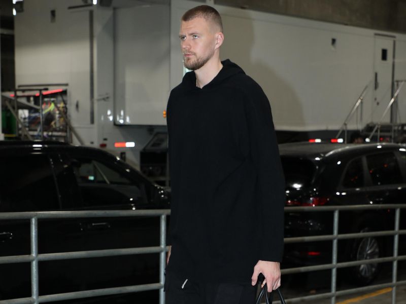 PORTLAND, OR - MARCH 11:  Kristaps Porzingis #8 of the Boston Celtics arrives to the arena before the game against the Portland Trail Blazers on March 11, 2024 at the Moda Center Arena in Portland, Oregon. NOTE TO USER: User expressly acknowledges and agrees that, by downloading and or using this photograph, user is consenting to the terms and conditions of the Getty Images License Agreement. Mandatory Copyright Notice: Copyright 2024 NBAE (Photo by Cameron Browne/NBAE via Getty Images)