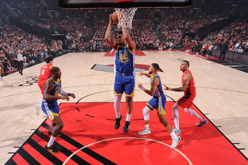 PORTLAND, OR - OCTOBER 23: Trayce Jackson-Davis #32 of the Golden State Warriors goes up for the rebound during the game against the Portland Trail Blazers on October 23, 2024 at the Moda Center Arena in Portland, Oregon. NOTE TO USER: User expressly acknowledges and agrees that, by downloading and or using this photograph, user is consenting to the terms and conditions of the Getty Images License Agreement. Mandatory Copyright Notice: Copyright 2024 NBAE (Photo by Cameron Browne/NBAE via Getty Images)