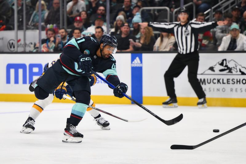 Mar 16, 2024; Seattle, Washington, USA; Seattle Kraken left wing Pierre-Edouard Bellemare (41) shoots the puck against the Nashville Predators during the second period at Climate Pledge Arena. Mandatory Credit: Steven Bisig-USA TODAY Sports