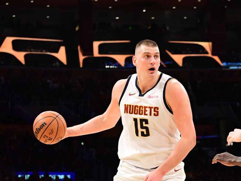 LOS ANGELES, CA - FEBRUARY 8: Nikola Jokic #15 of the Denver Nuggets dribbles the ball during the game against the Los Angeles Lakers on February 8, 2024 at Crypto.Com Arena in Los Angeles, California. NOTE TO USER: User expressly acknowledges and agrees that, by downloading and/or using this Photograph, user is consenting to the terms and conditions of the Getty Images License Agreement. Mandatory Copyright Notice: Copyright 2024 NBAE (Photo by Adam Pantozzi/NBAE via Getty Images)