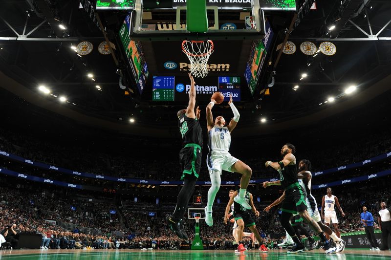 BOSTON, MA - DECEMBER 16: Paolo Banchero #5 of the Orlando Magic drives to the basket during the game against the Boston Celtics on December 16, 2022 at the TD Garden in Boston, Massachusetts.  NOTE TO USER: User expressly acknowledges and agrees that, by downloading and or using this photograph, User is consenting to the terms and conditions of the Getty Images License Agreement. Mandatory Copyright Notice: Copyright 2022 NBAE  (Photo by Brian Babineau/NBAE via Getty Images)