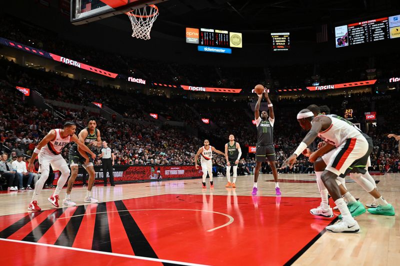 PORTLAND, OREGON - NOVEMBER 13: Naz Reid #11 of the Minnesota Timberwolves shoots a free throw during the first quarter of the game against the Portland Trail Blazers at Moda Center on November 13, 2024 in Portland, Oregon. NOTE TO USER: User expressly acknowledges and agrees that, by downloading and or using this photograph, User is consenting to the terms and conditions of the Getty Images License Agreement. (Photo by Alika Jenner/Getty Images)