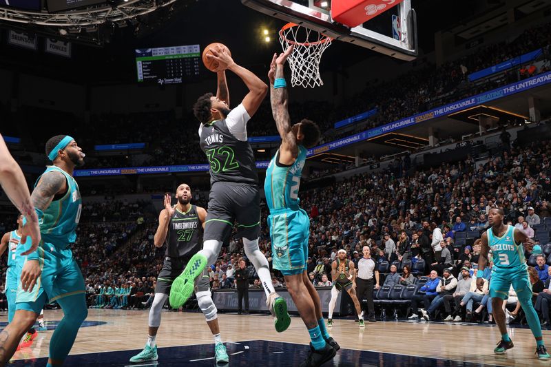 MINNEAPOLIS, MN -  JANUARY 22: Karl-Anthony Towns #32 of the Minnesota Timberwolves shoots the ball during the game against the Charlotte Hornets on January 22, 2024 at Target Center in Minneapolis, Minnesota. NOTE TO USER: User expressly acknowledges and agrees that, by downloading and or using this Photograph, user is consenting to the terms and conditions of the Getty Images License Agreement. Mandatory Copyright Notice: Copyright 2024 NBAE (Photo by David Sherman/NBAE via Getty Images)