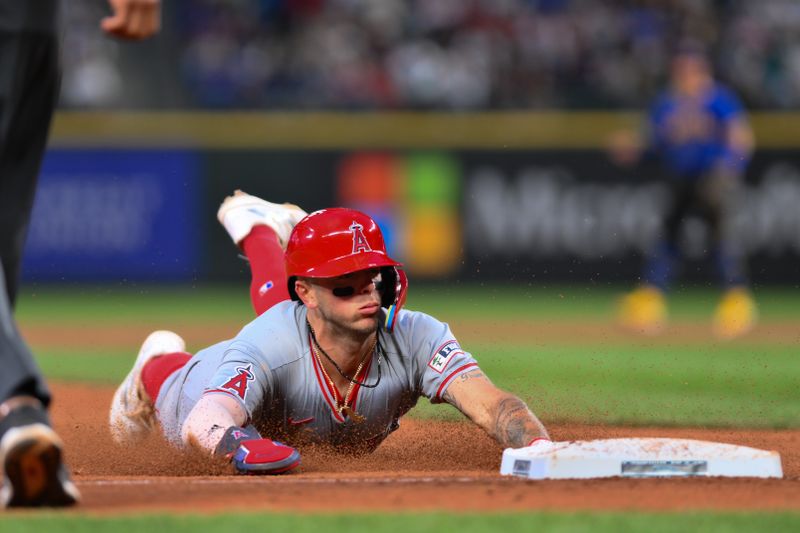 May 31, 2024; Seattle, Washington, USA; Los Angeles Angels shortstop Zach Neto (9) steals third base during the seventh inning against the Seattle Mariners at T-Mobile Park. Mandatory Credit: Steven Bisig-USA TODAY Sports