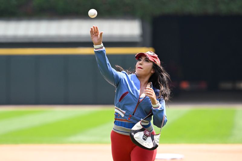 Jul 13, 2024; Chicago, Illinois, USA;  Grammy-winning left-field pop polyglot Kali Uchis throws out a ceremonial first pitch before the game between the Chicago White Sox and the Pittsburgh Pirates at Guaranteed Rate Field. Mandatory Credit: Matt Marton-USA TODAY Sports