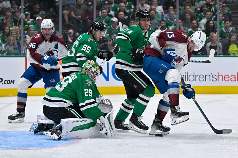 May 7, 2024; Dallas, Texas, USA; Colorado Avalanche right wing Mikko Rantanen (96) and right wing Valeri Nichushkin (13) and Dallas Stars goaltender Jake Oettinger (29) and center Roope Hintz (24) battle for control of the puck in the Stars zone during the first period in game one of the second round of the 2024 Stanley Cup Playoffs at American Airlines Center. Mandatory Credit: Jerome Miron-USA TODAY Sports