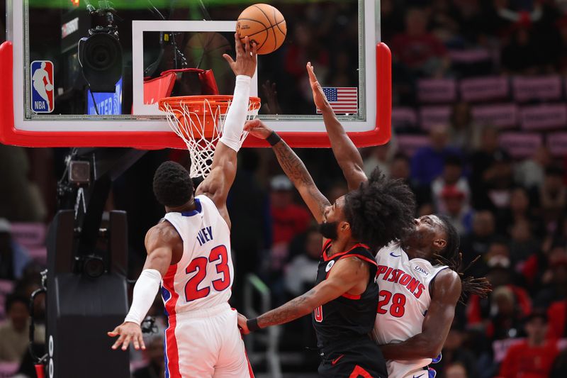 CHICAGO, ILLINOIS - FEBRUARY 27: Jaden Ivey #23 of the Detroit Pistons blocks a shot by Coby White #0 of the Chicago Bulls during the second half at the United Center on February 27, 2024 in Chicago, Illinois. NOTE TO USER: User expressly acknowledges and agrees that, by downloading and or using this photograph, User is consenting to the terms and conditions of the Getty Images License Agreement. (Photo by Michael Reaves/Getty Images)