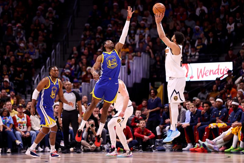 DENVER, COLORADO - DECEMBER 25: Jamal Murray #27 of the Denver Nuggets shoots over Jonathan Kuminga #00 of the Golden State Warriors at Ball Arena on December 25, 2023 in Denver, Colorado. NOTE TO USER: User expressly acknowledges and agrees that, by downloading and/or using this Photograph, user is consenting to the terms and conditions of the Getty Images License Agreement. (Photo by Jamie Schwaberow/Getty Images)