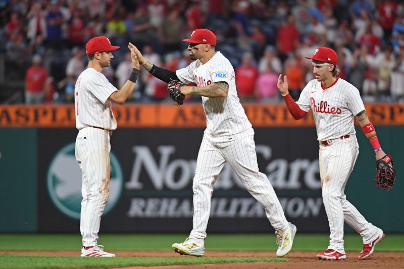 Jun 30, 2025; Philadelphia, Pennsylvania, USA; Philadelphia Phillies shortstop Trea Turner (7) and  outfielder Nick Castellanos (8) celebrate win against the San Diego Padres at Citizens Bank Park. Mandatory Credit: Eric Hartline-Imagn Images