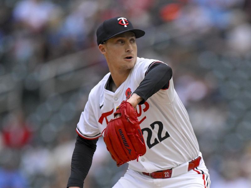 May 27, 2024; Minneapolis, Minnesota, USA; Minnesota Twins relief pitcher Griffin Jax (22) delivers a pitch against the Kansas City Royals during the eighth inning at Target Field. Mandatory Credit: Nick Wosika-USA TODAY Sports