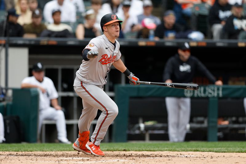 May 26, 2024; Chicago, Illinois, USA; Baltimore Orioles first baseman Ryan Mountcastle (6) hits a double against the Chicago White Sox during the fourth inning at Guaranteed Rate Field. Mandatory Credit: Kamil Krzaczynski-USA TODAY Sports