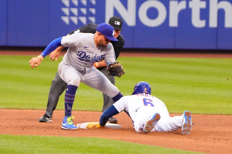 Jul 16, 2023; New York City, New York, USA; New York Mets right fielder Starling Marte (6) steals second base ahead of the tag by Los Angeles Dodgers shortstop Miguel Rojas (11) during the fifth inning at Citi Field. Mandatory Credit: Gregory Fisher-USA TODAY Sports